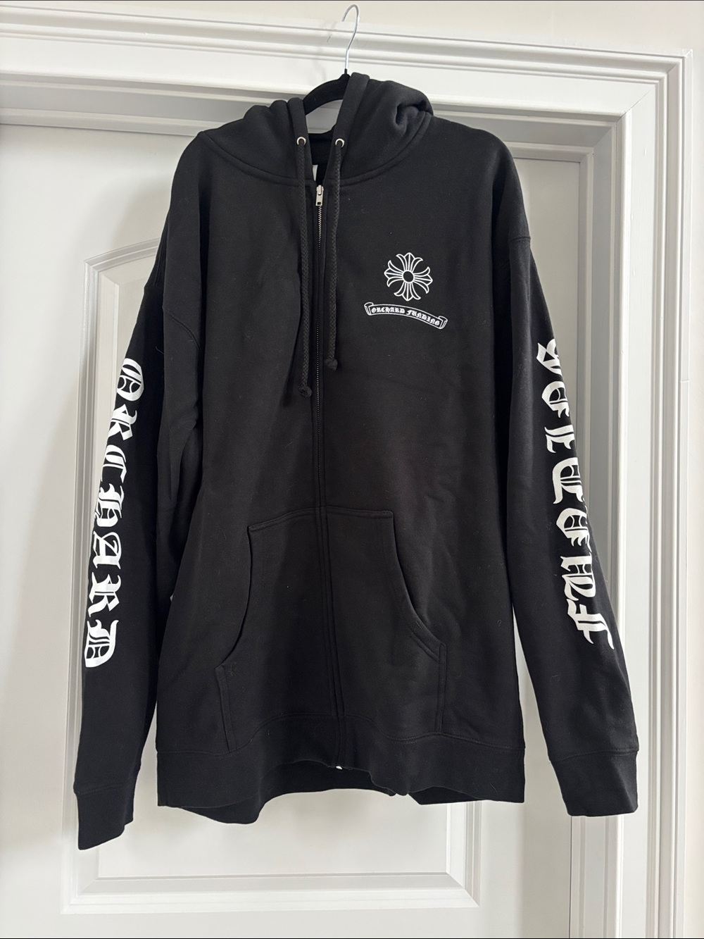 Black Zip Hoodie with White Sleeve Script and Chest Emblem